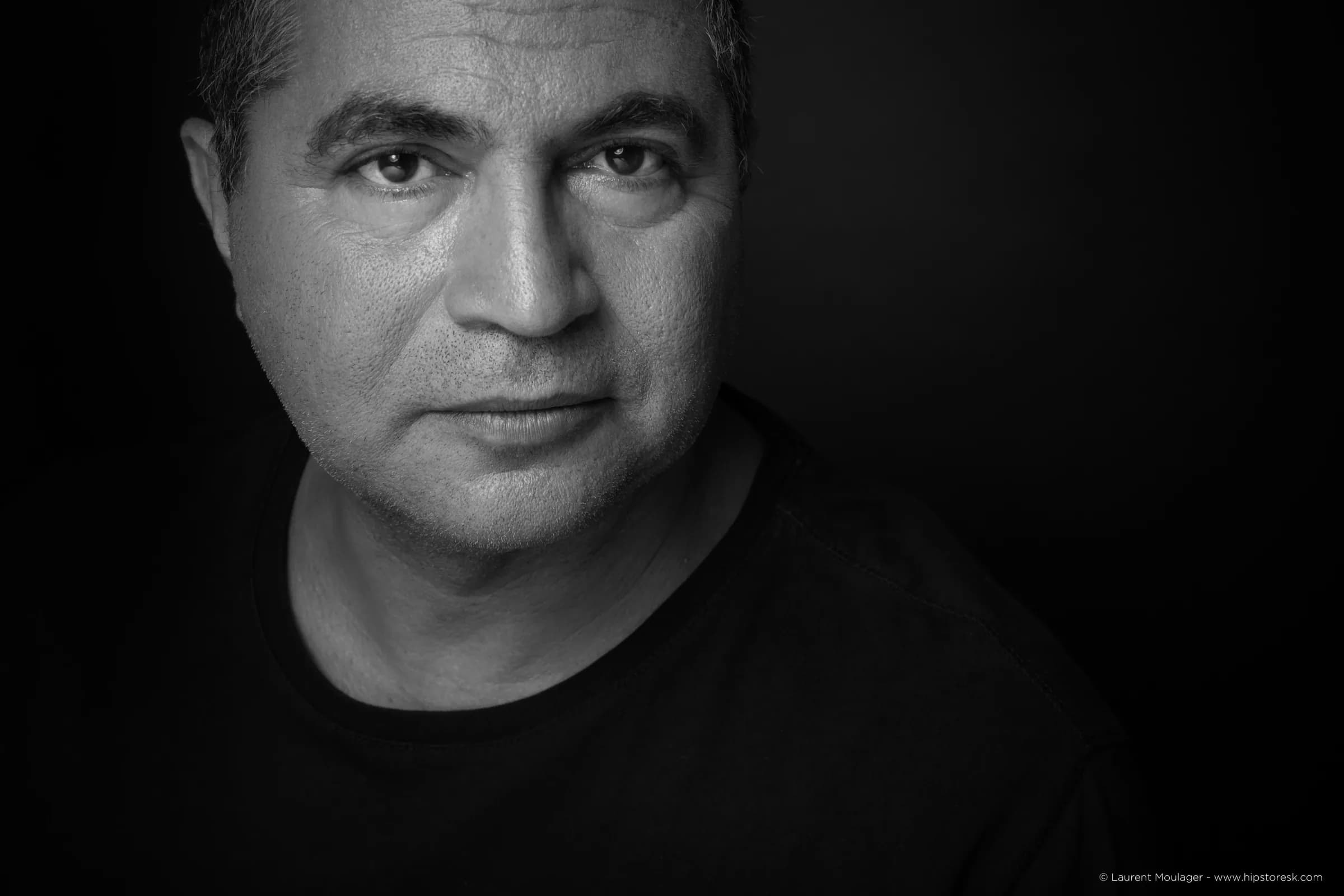 Black-and-white portrait of Mahi Binebine